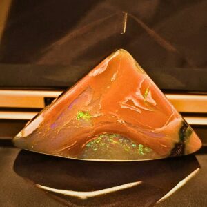 Ravishing Natural Queensland Boulder Opal 49.6 Ct featuring vibrant blue and green play-of-colour, polished freeform shape, sourced from Queensland, Australia, showcasing natural brilliance.