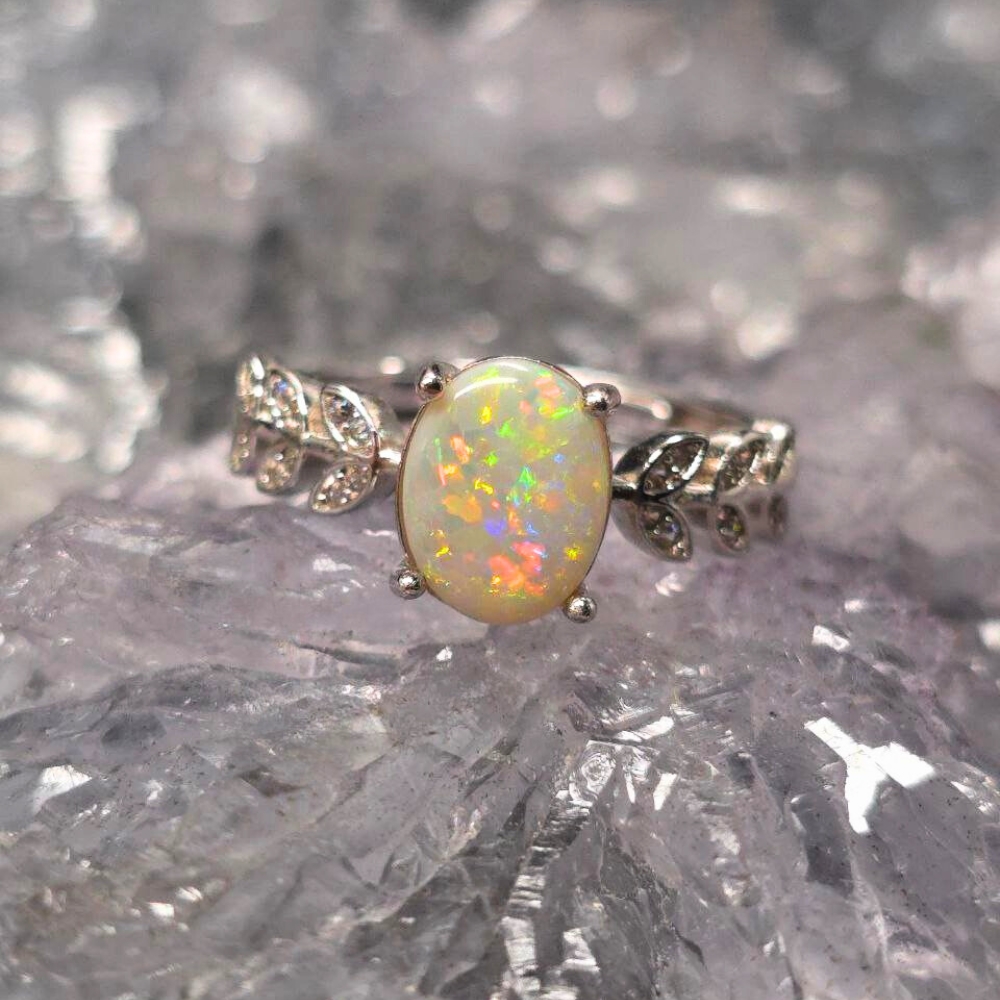 ORWOSPO-1109.7 Lightning Ridge White Opal ring in 925 silver vine filigree adjustable band size US 6.75 showcasing a kaleidoscope of shifting colours with luminous, natural fire.