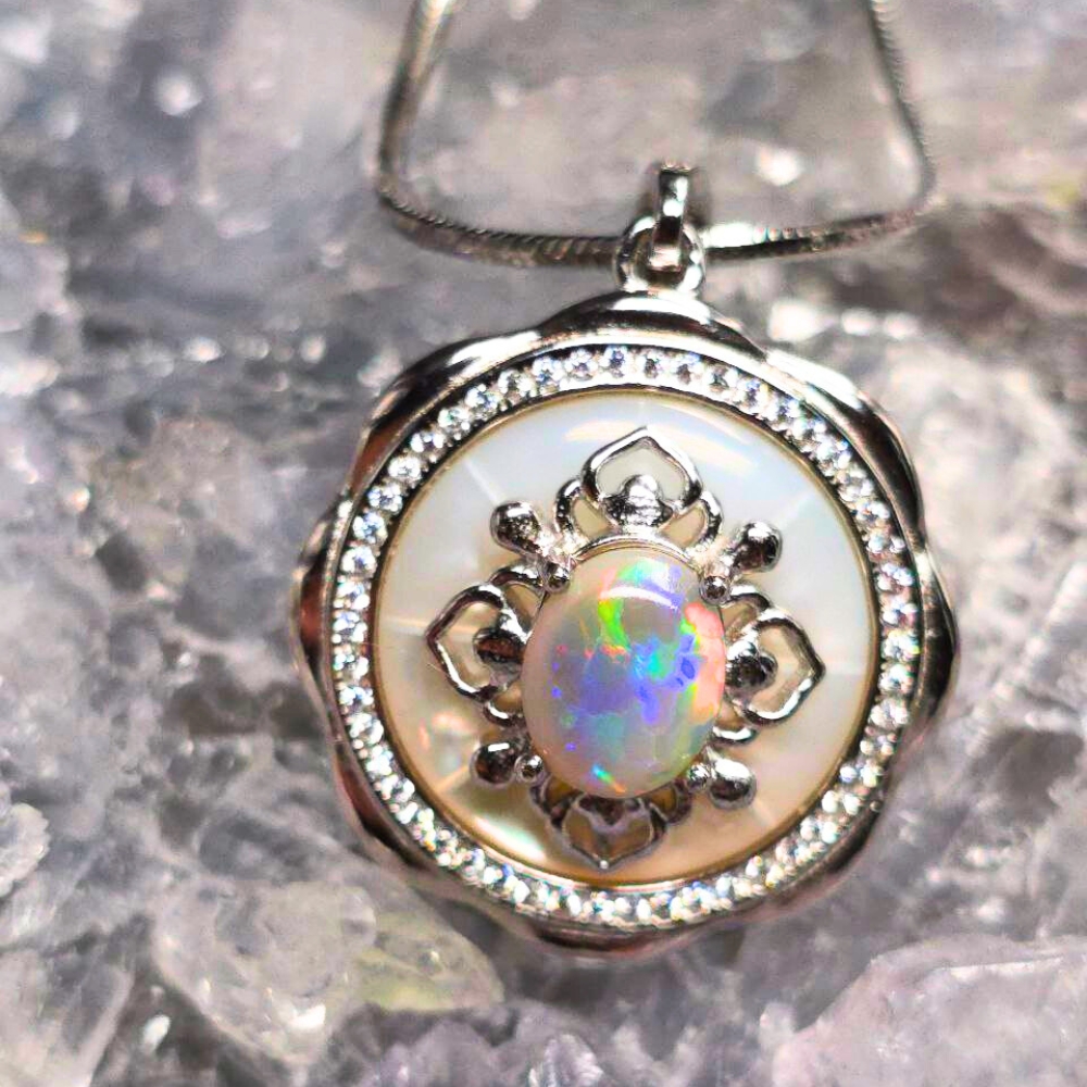 ONDOSPO-1156.5 Abyssal Haven 1.50ct Lightning Ridge Dark Opal pendant set in polished 925 Silver on adjustable chain showing blue, green, orange, gold, pink, and red fire flashes