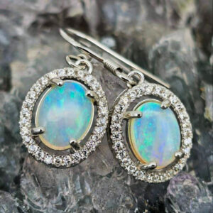 Close-up of Jadea Oli Lightning Ridge natural Crystal Opal 1.40ct S925 Silver Hook Earrings, radiating soft green fire with elegant luminous natural Australian brilliance.
