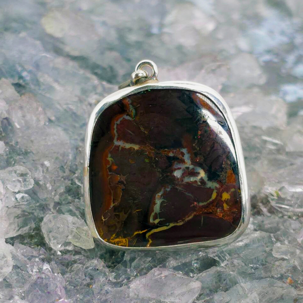 OPBRSPO-1396 (4) Hand-carved Queensland natural Boulder Opal pendant showing shifting blue, green, and gold play-of-colour in sterling silver.