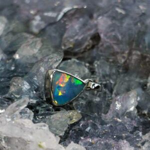 Shandybliss Lightning Ridge Natural Doublet Opal 0.28g pendant in S925 Silver, displaying blue, green, orange, gold, pink, and red colour flashes.