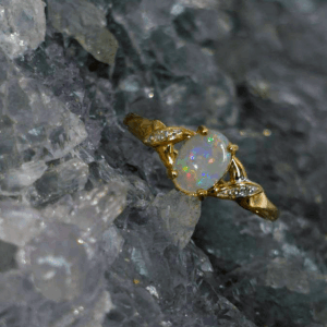 Ovanza Sorelle Natural Coober Pedy White Opal 0.80ct 9K Gold Ring with Natural Diamonds US 7+3⁄4, showcasing luminous Australian elegance and timeless brilliance.