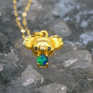Aurevessa Natural Lightning Ridge Doublet Opal 0.07g Gold-Plated S925 Silver Necklace featuring blue, green, orange, and gold flashes, koala-inspired beauty, 40 cm chain with 5 cm extension.