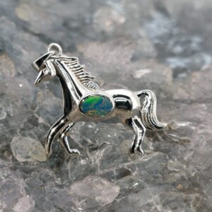 Gemirra natural Lightning Ridge doublet opal 0.2g sterling silver horse pendant with iridescent colour play and detailed equine design symbolising freedom and strength.