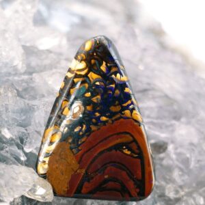 The Frontier" 18.00ct Natural Queensland Boulder Opal with B3 grade brightness, freeform low dome, organic landscape-inspired patterns, and vibrant green and purple play-of-colour.