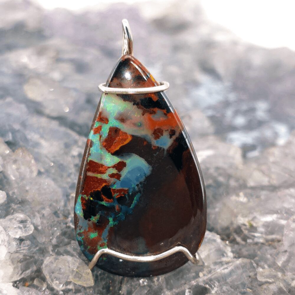 OPBRSPO-1598 (2) Natural Queensland Boulder Opal S925 custom wire-wrapped pendant displaying vivid green, and other vibrant hues, symbolizing nature, renewal, balance, and transformation.