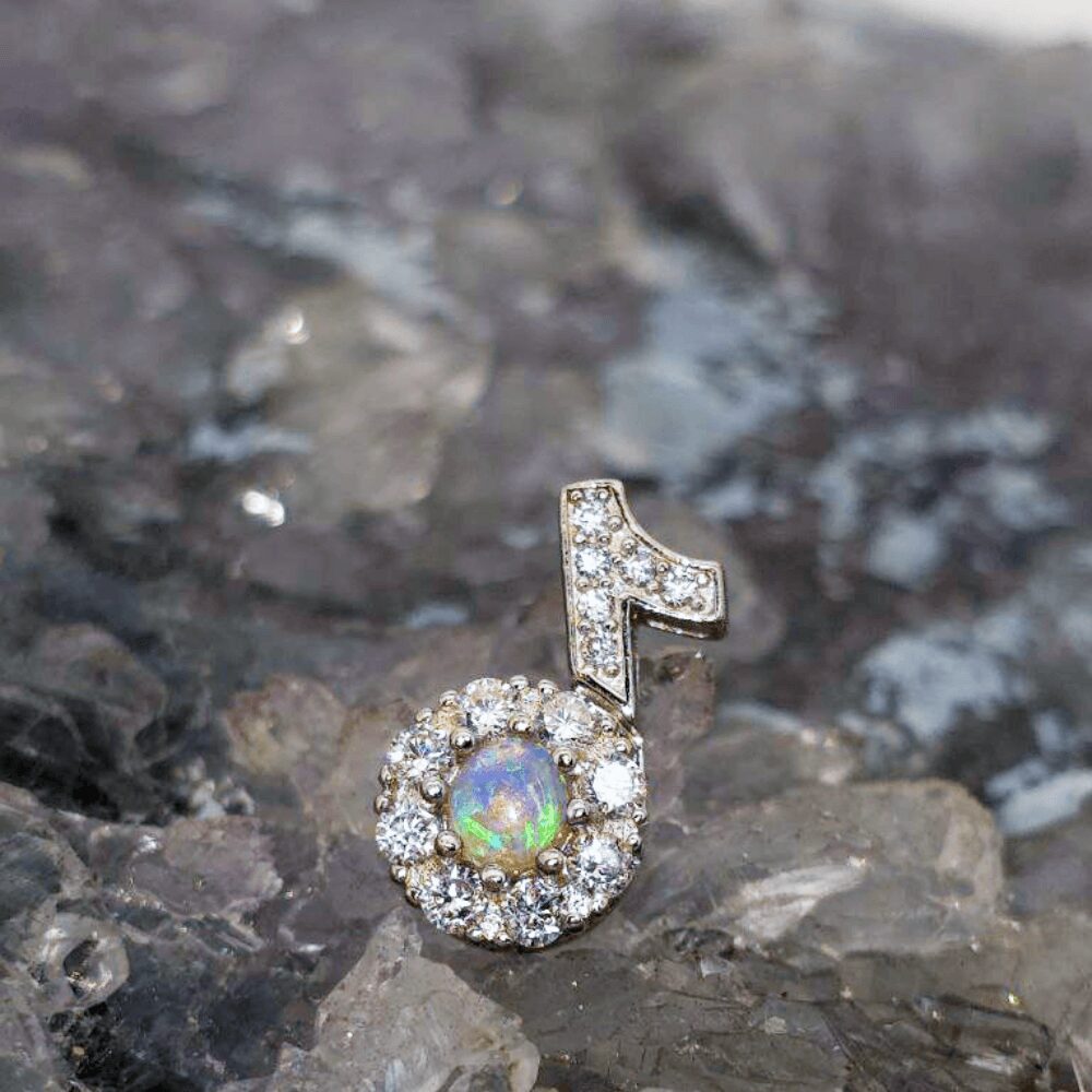 OPCOSPO-1574 (1) Australian Lightning Ridge natural crystal opal 0.25ct S925 spinner/fidget pendant with CZ accent stones and radiant, steady flashes of colour play.