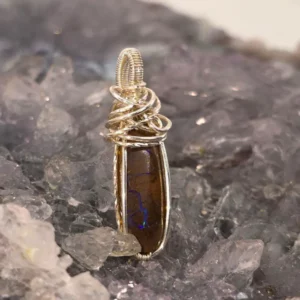 Queensland Boulder Opal 6.00ct Wire-Wrapped S925 Pendant featuring a freeform natural boulder opal, handcrafted S925 silver wire wrap, blue, green, and purple hues.