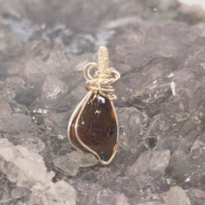 Natural Queensland Boulder Opal 15ct Wire-Wrapped S925 Silver Pendant displays unique opal artistry with vibrant colour play, handcrafted silver, and timeless elegance.