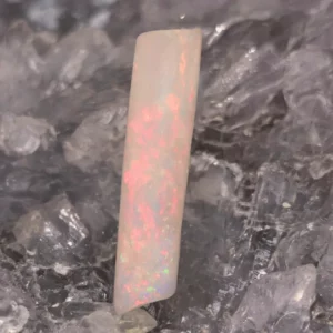 Tivara 5 ct Coober Pedy natural Crystal Opal belemnite fossil with inclusions, freeform shape, vibrant blue, green, pink, orange, and gold play-of-colour, polished low dome