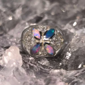 Kayrisma marquis cut Lightning Ridge natural crystal opal inlay 0.55 ct. charm in 925 silver with cubic zirconia accent, displaying multicolour fire