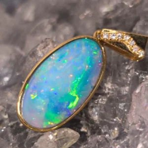 Aureviana 8.00 ct Coober Pedy natural doublet opal pendant in handmade 14 carat yellow gold with sparkling natural diamonds, high-dome oval cabochon opal displaying vibrant play-of-colour.